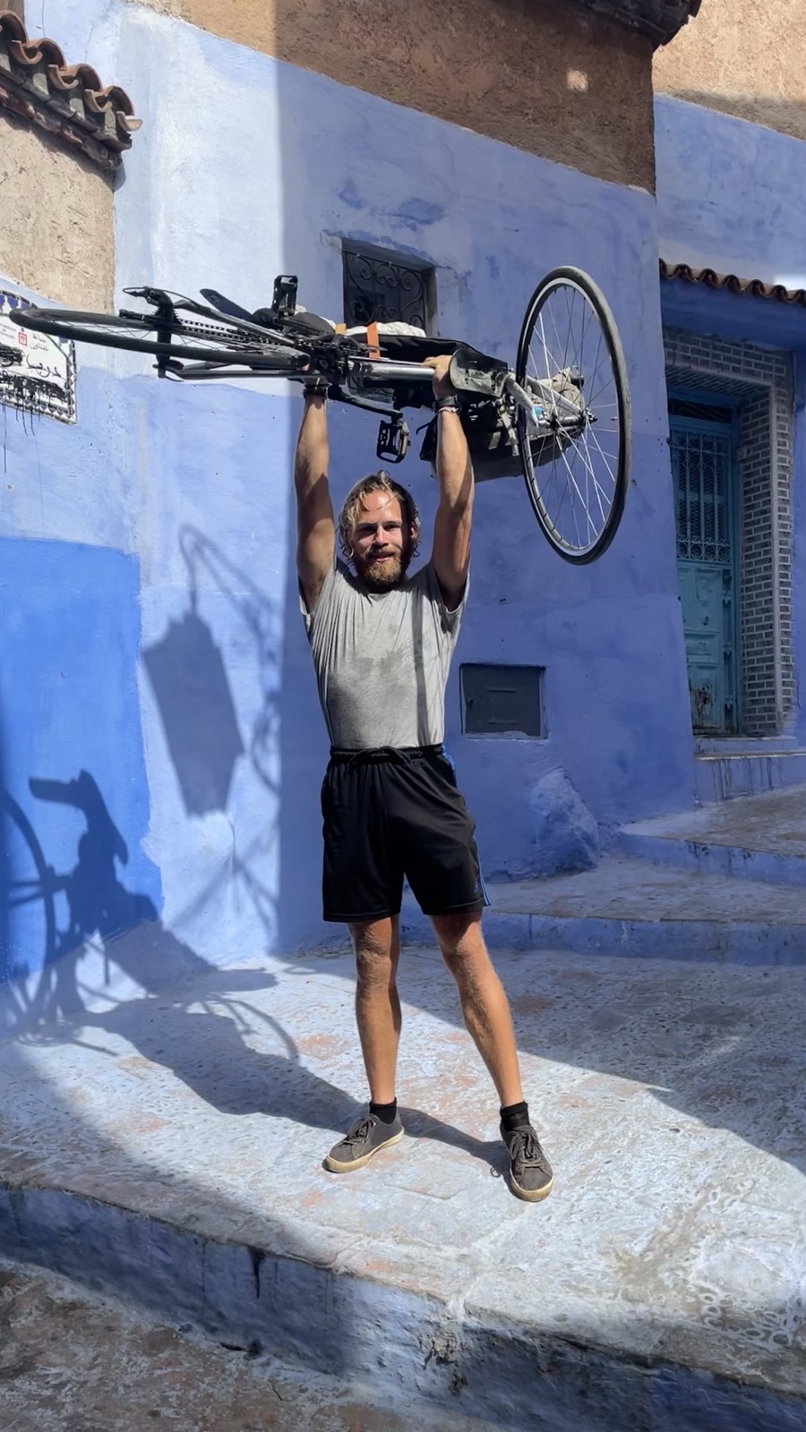 Jacob with a bicycle in Chefchaouen after cycling solo from Sweden to Africa