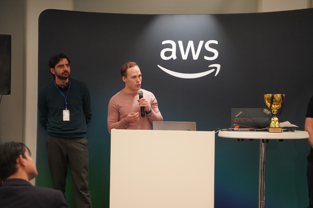 Presenting the SunStreet energy price predictor on stage at the AI Business Hackathon Grand Final, AWS Stockholm